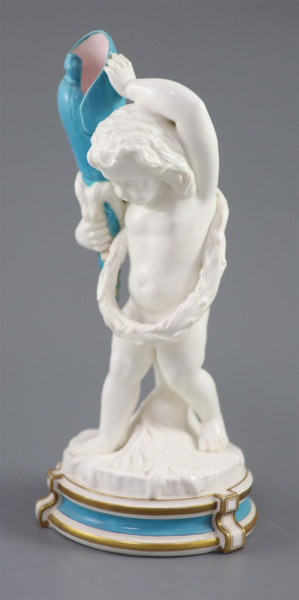 A large late 19th century French porcelain figure of Cupid, an English bone china cherub vase and a similar sweetmeat dish, tallest 3